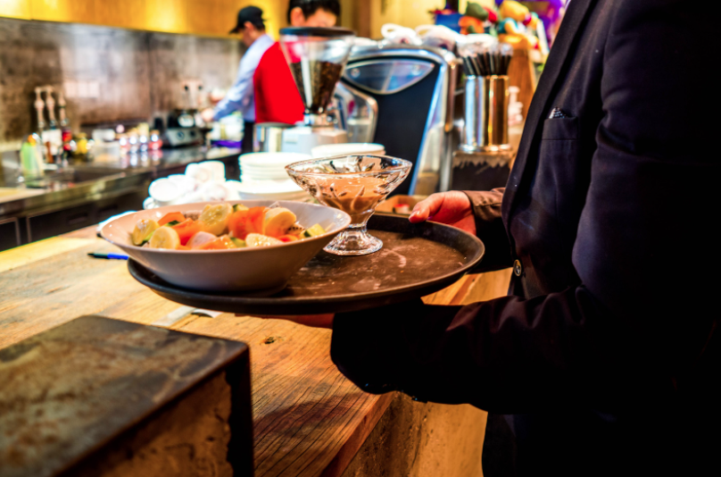 Waiter holding tray